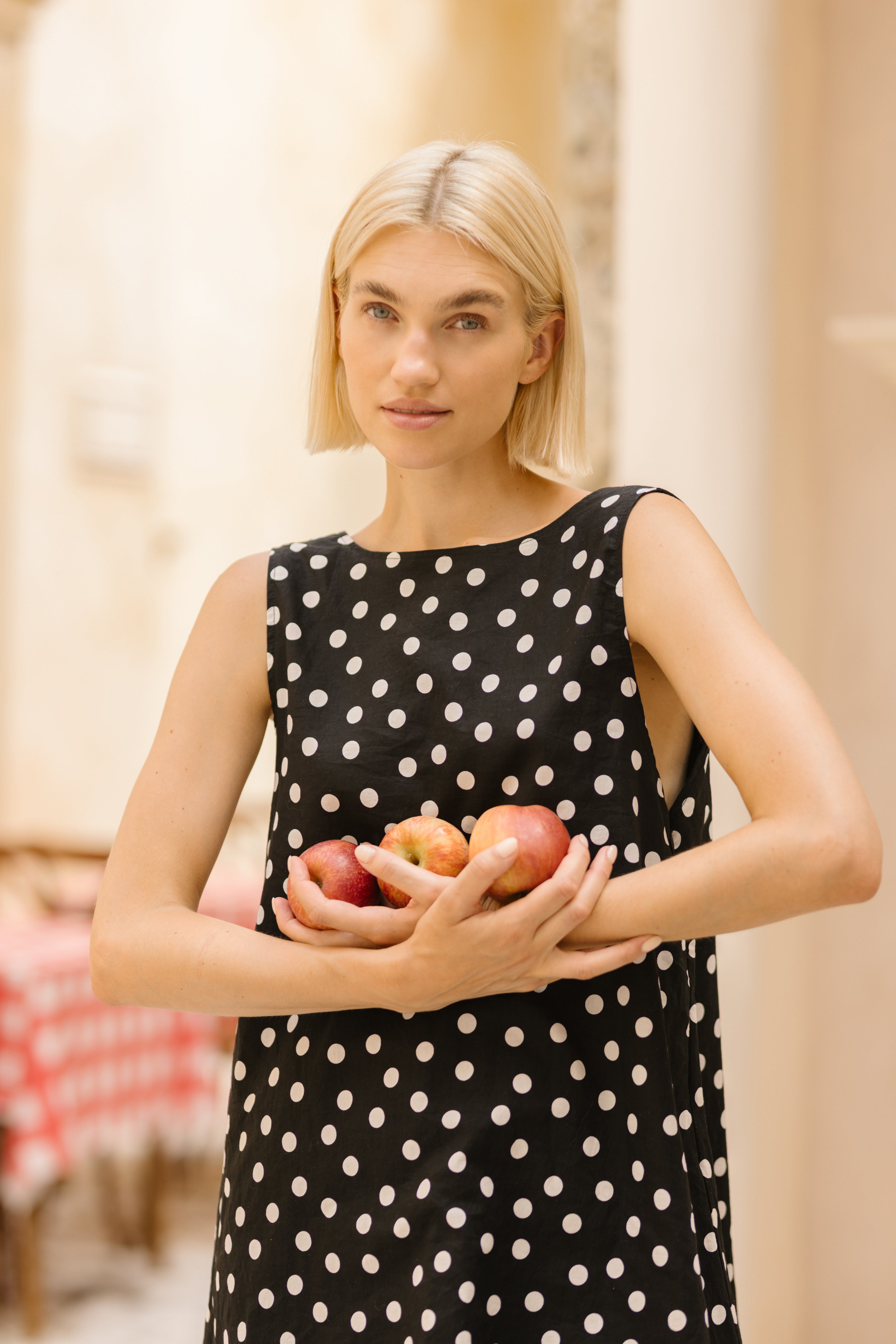 Polka dot mini dress tea party outfit idea spring 2026, feminine short cotton dress for garden brunch, bridal shower, and Mother's Day celebration

