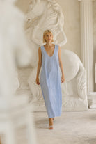 Light blue gingham cotton maxi on beach vacation — easy throw-on resort dress, Puka The Label