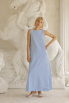 Light blue gingham reversible Gili maxi dress side view — quiet luxury beach style, Puka The Label