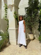 White reversible Gili maxi dress styled for coastal wedding — elegant destination outfit, Puka The Label