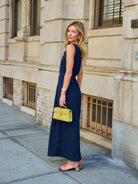Natalie Simkins in the Camilla Dress Midnight, full-length view with self-tie belt, NYC sidewalk