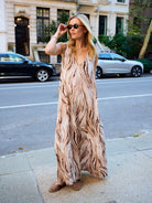 Natalie Simkins wearing the Puka Cleo in Brown Zebra — sleeveless V-neck maxi dress, UES NYC street