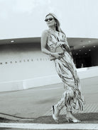Black and white editorial of Natalie Simkins in the Cleo maxi dress outside the Guggenheim Museum NYC