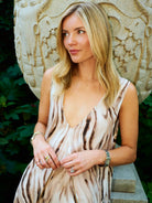 Puka Cleo maxi dress in Brown Zebra watercolor print, garden setting, Central Park NYC