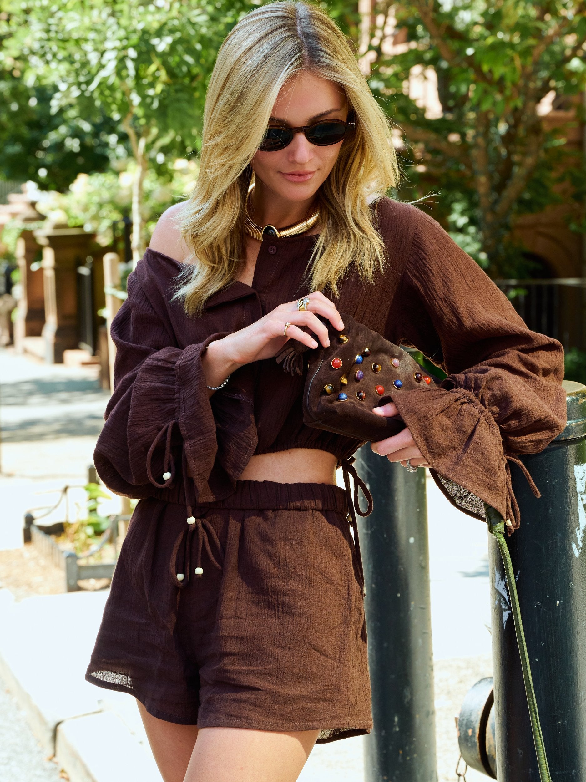 Natalie Simkins crossing NYC street in the Colette Set Espresso with her dog and NYC yellow taxi