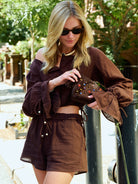 Natalie Simkins crossing NYC street in the Colette Set Espresso with her dog and NYC yellow taxi