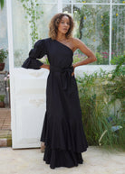 Chic black maxi dress with ruffles and one sleeve for a beach or black tie wedding, sophisticated dresses for parties, elegant maxi dresses that are simple yet stunning