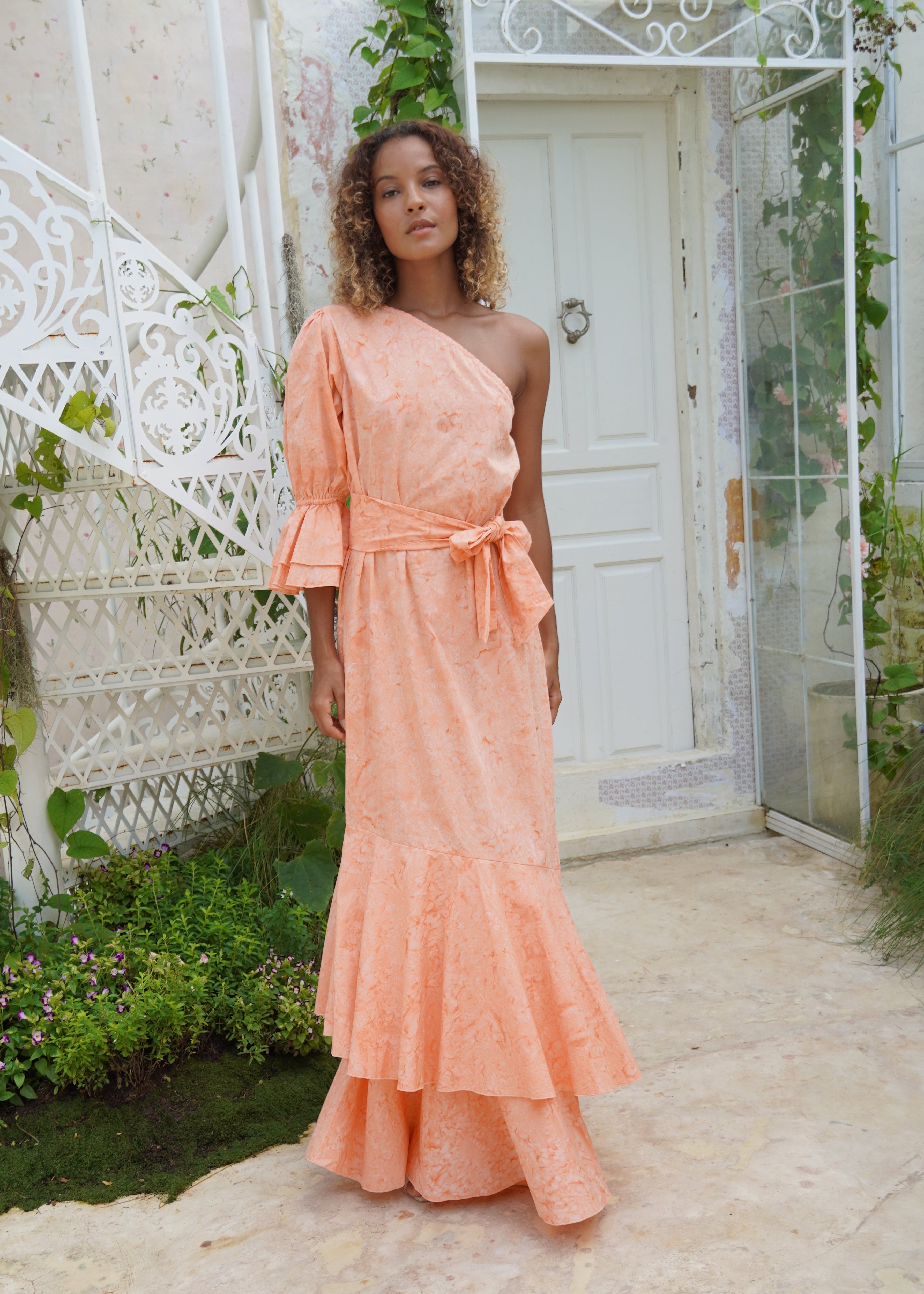 Peach feminine wedding guest dress inspired by the garden. Soft dresses to wear at a tea party or in the summer at a wedding