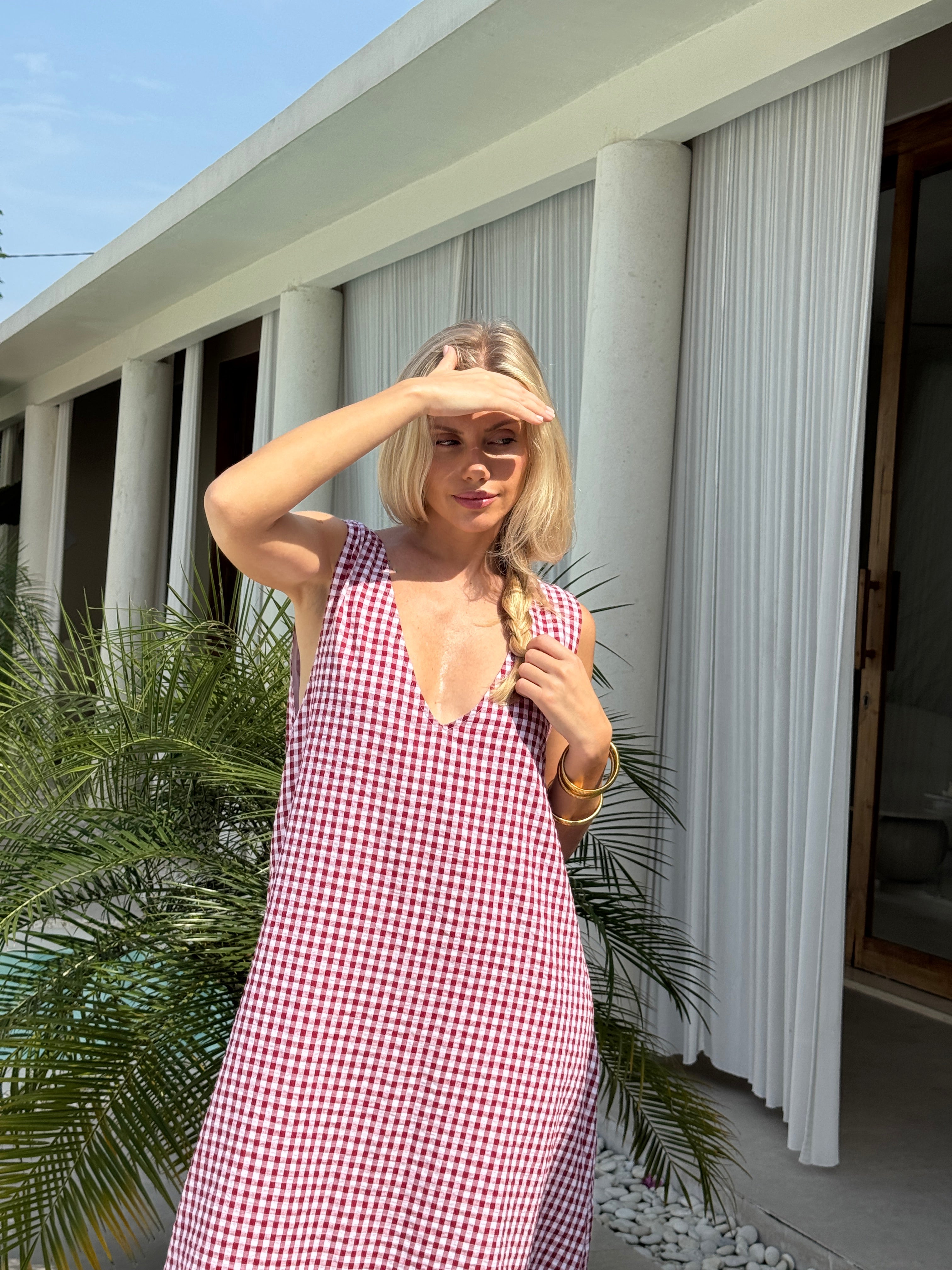 Red gingham Gili maxi styled for summer dinner and rooftop party — versatile cotton maxi, Puka The Label