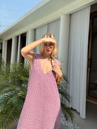 Red gingham Gili maxi styled for summer dinner and rooftop party — versatile cotton maxi, Puka The Label