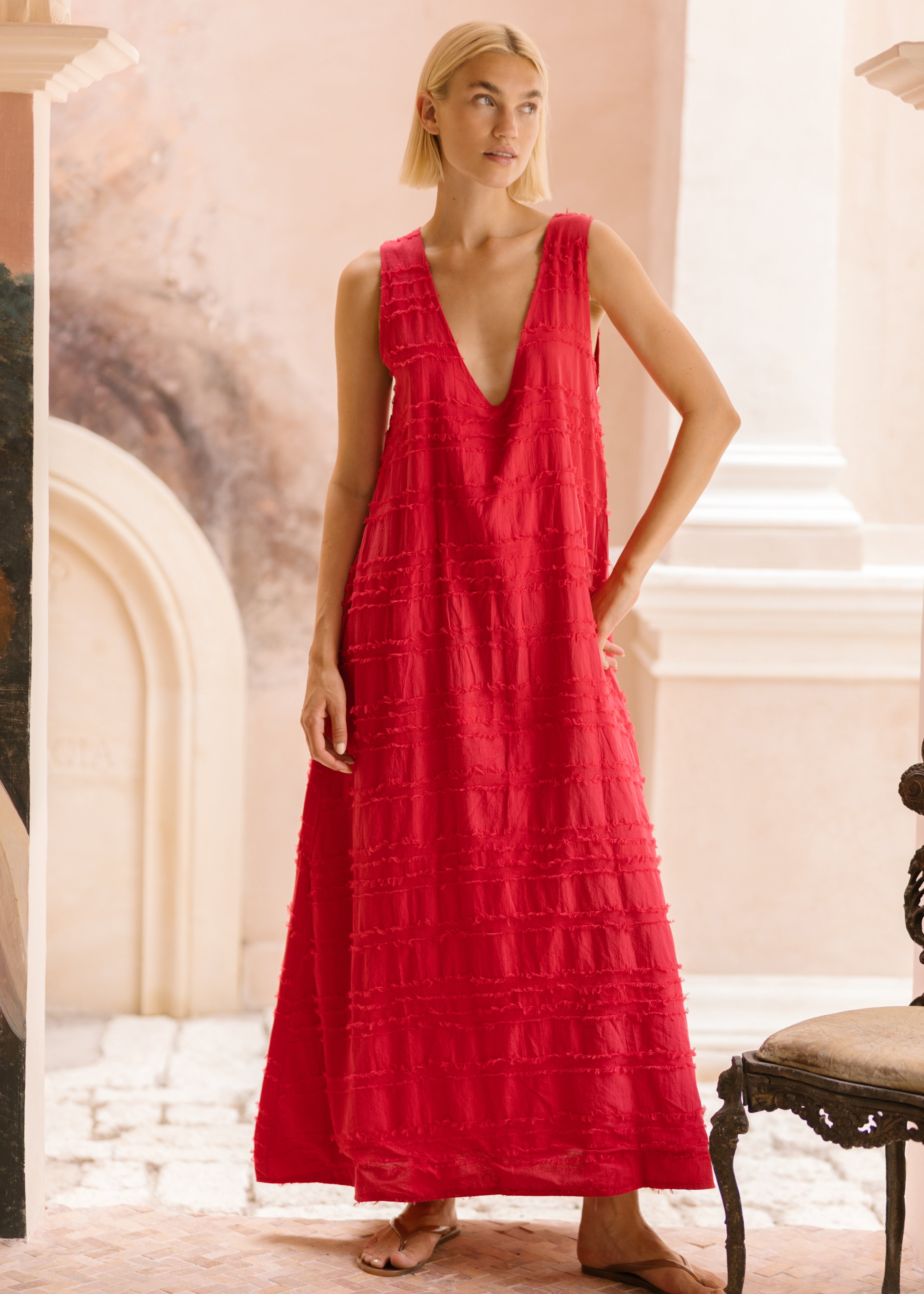 Red textured cotton maxi dress 4th of July outfit idea 2026, bold feather print dress for summer BBQ, lake house party, and patriotic celebration
