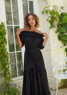 Ruffled off the shoulder black dress coastal evening outfit idea, dramatic flowy maxi dress for beach weddings and parties