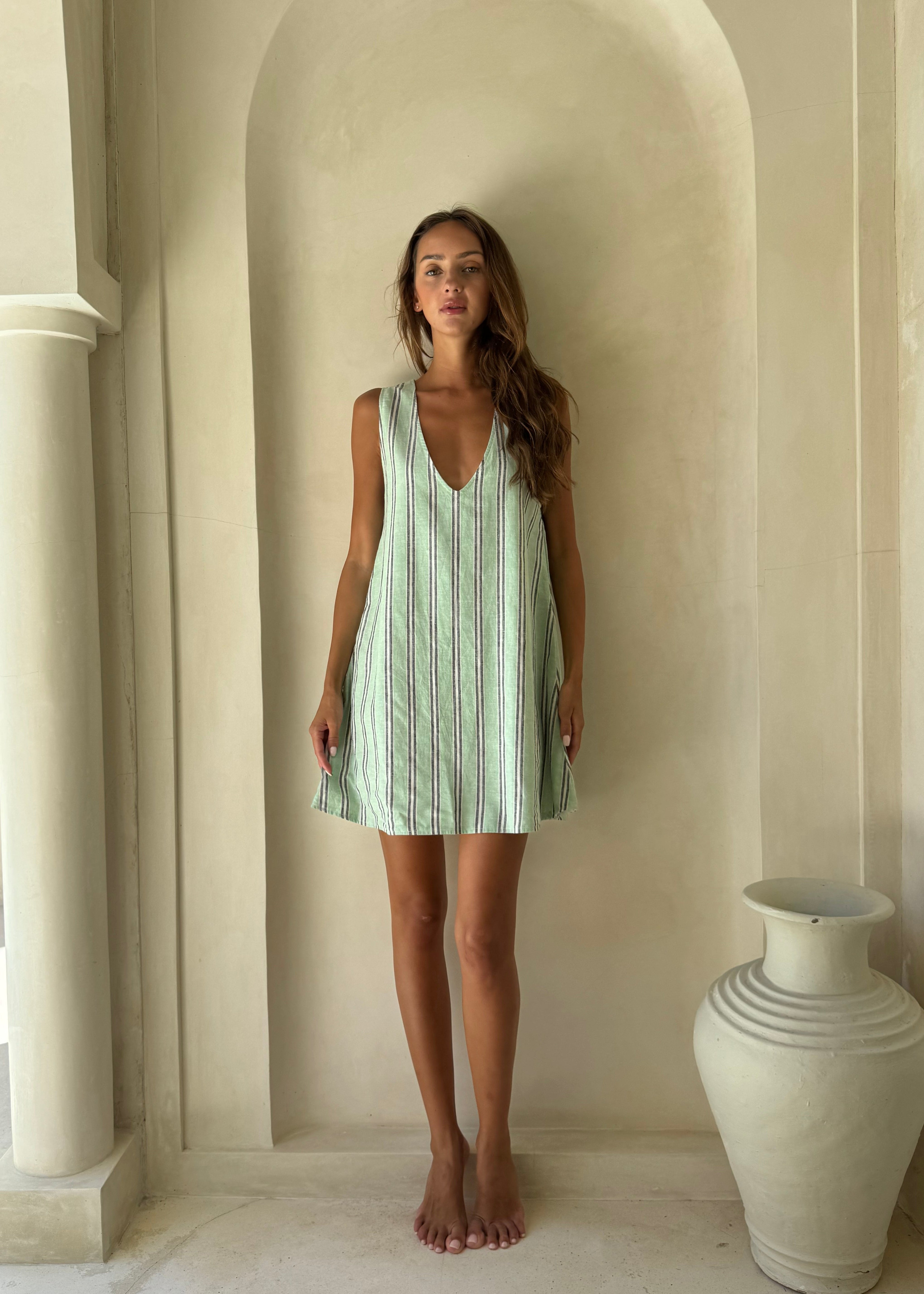 Vibrant green stripe mini dress Miami and Palm Beach resort outfit 2026, bright beach inspired preppy dress for tropical vacation and waterfront occasion

