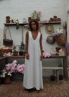 What to wear in the Hamptons 2026 — neutral beige gingham maxi dress, chic easy weekend look, Puka The Label