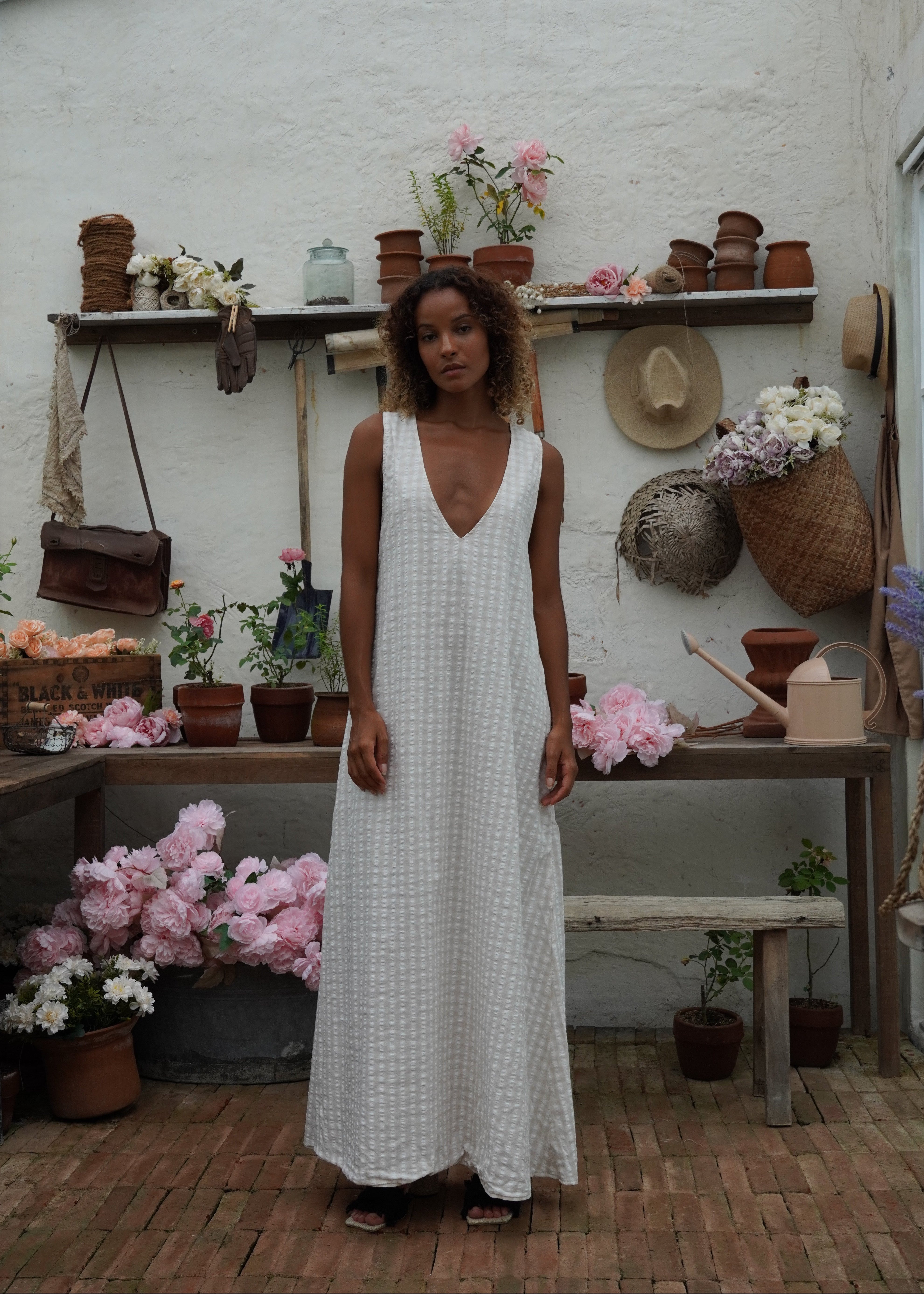 What to wear in the Hamptons 2026 — neutral beige gingham maxi dress, chic easy weekend look, Puka The Label