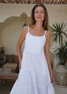 White tiered cotton maxi dress styled with beaded necklace summer 2026, Waverly Dress dressed up for coastal brunch and garden party Puka The Label