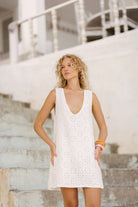 White floral eyelet cotton mini dress rehearsal dinner and beachside wedding outfit 2026, elegant reversible Mini Gili dress for coastal celebration Puka The Label