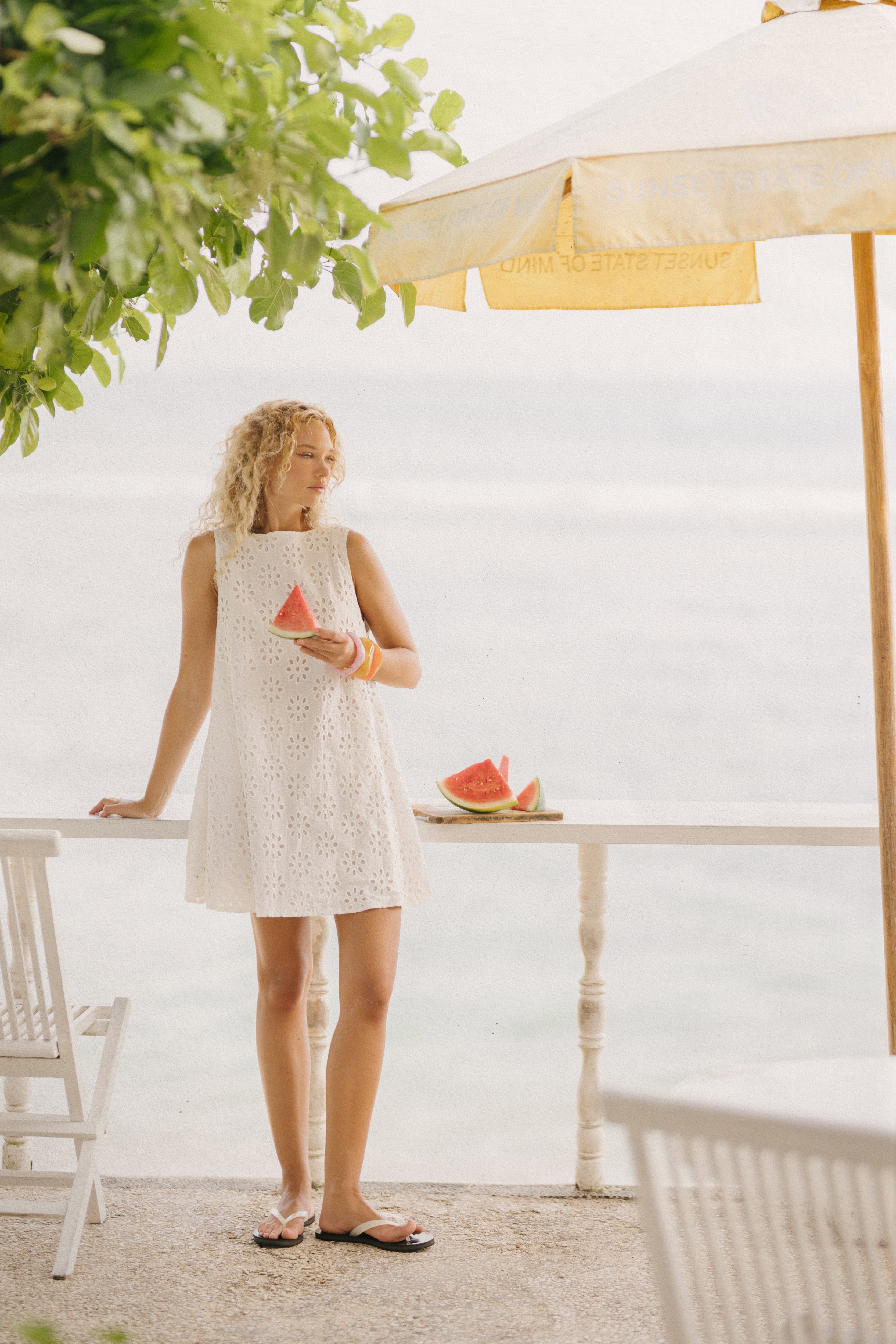 White floral eyelet cotton mini dress Anna Maria Island Florida spring outfit 2026, feminine reversible Mini Gili dress for Gulf Coast beach vacation