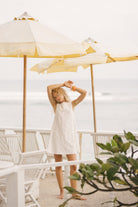 White floral eyelet cotton mini dress Hilton Head beach vacation outfit 2026, feminine reversible Mini Gili dress for South Carolina coastal getaway