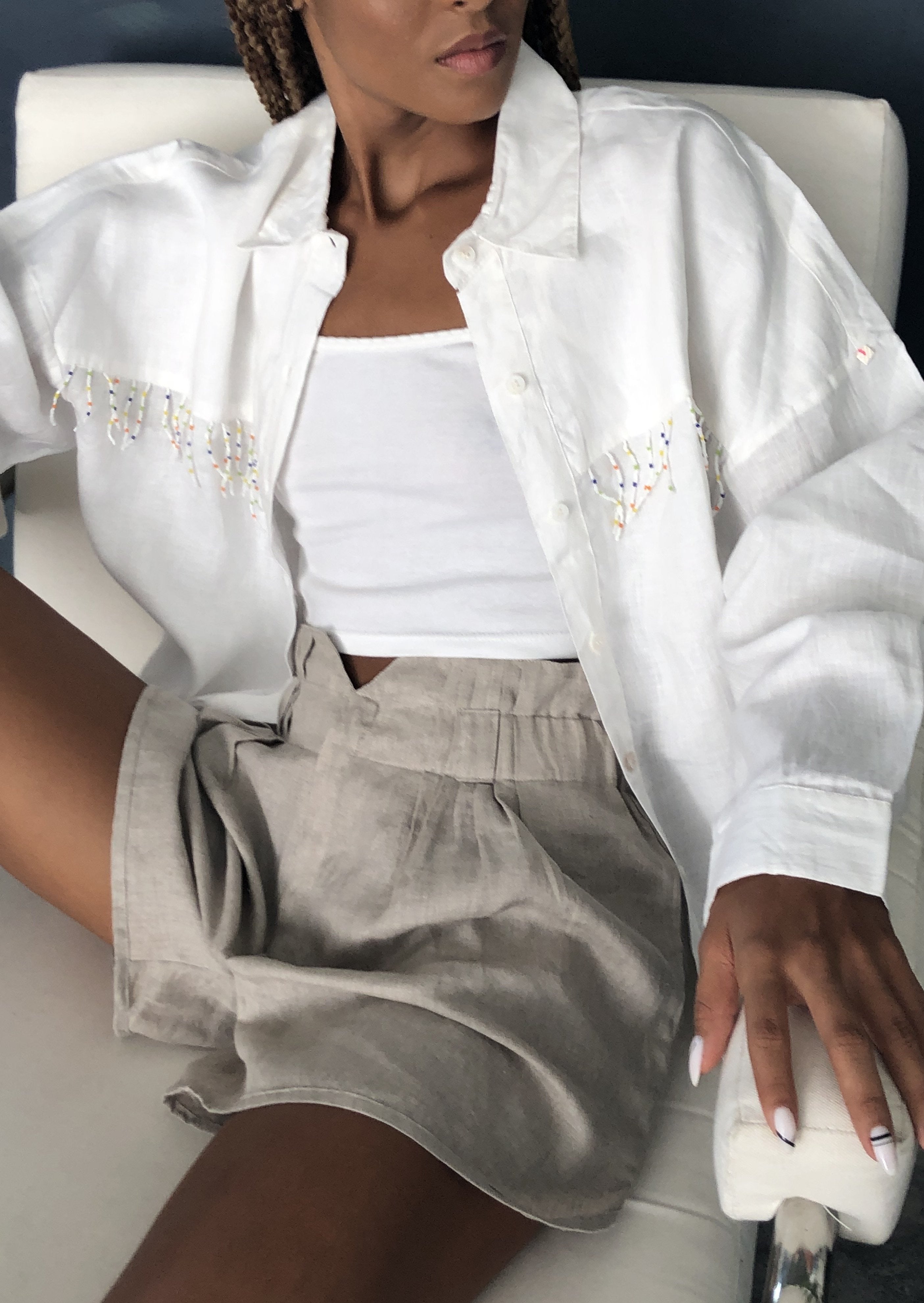 White Ulu with multi-color fringe styled in a western-inspired fall look — Puka The Label fringe blouse for ranch-to-resort travel