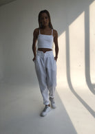 Puka Pantai Pant in White — flowy white linen pants for women, effortless warm weather style for vacation and coastal getaways