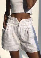 Lightweight white linen shorts for women — coastal style beach outfit, Nantucket and Hamptons inspired look