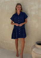 Navy cotton button-up mini dress — a flattering dress for women headed to a garden party or Martha's Vineyard weekend