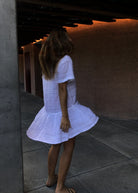 White cotton button-up dress for a boat day and harbor party — classic Nantucket summer dress